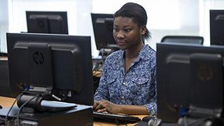 student working in a computer lab